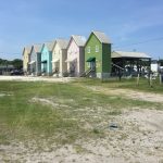 Strange little buildings connected to boat docks on Dauphin Island